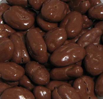 Chocolate Amaretto Pecan Halves - Large pecan halves are covered in a luscious amaretto flavored milk chocolate.  A great taste packaged in our one-pound signature box with a gold cord.